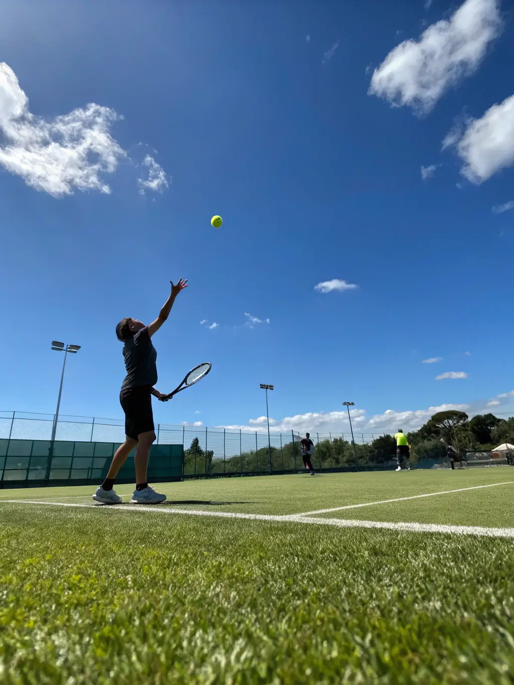A dynamic action shot of a tennis player performing a high-intensity agility drill on the court, showcasing speed and precision.